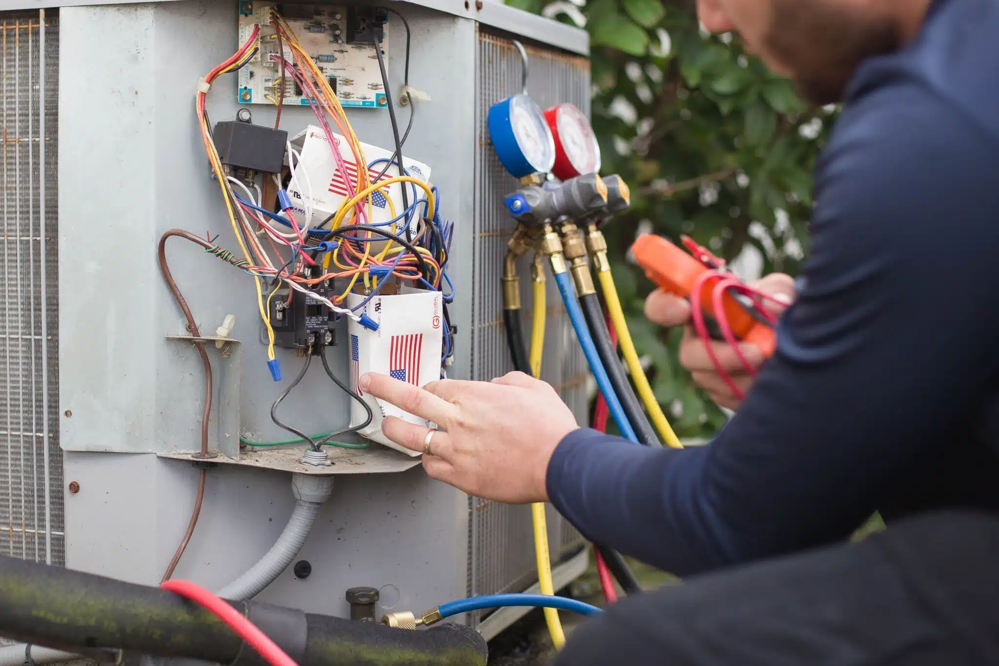 Working on an AC outdoors air-conditioner, AC Repair.