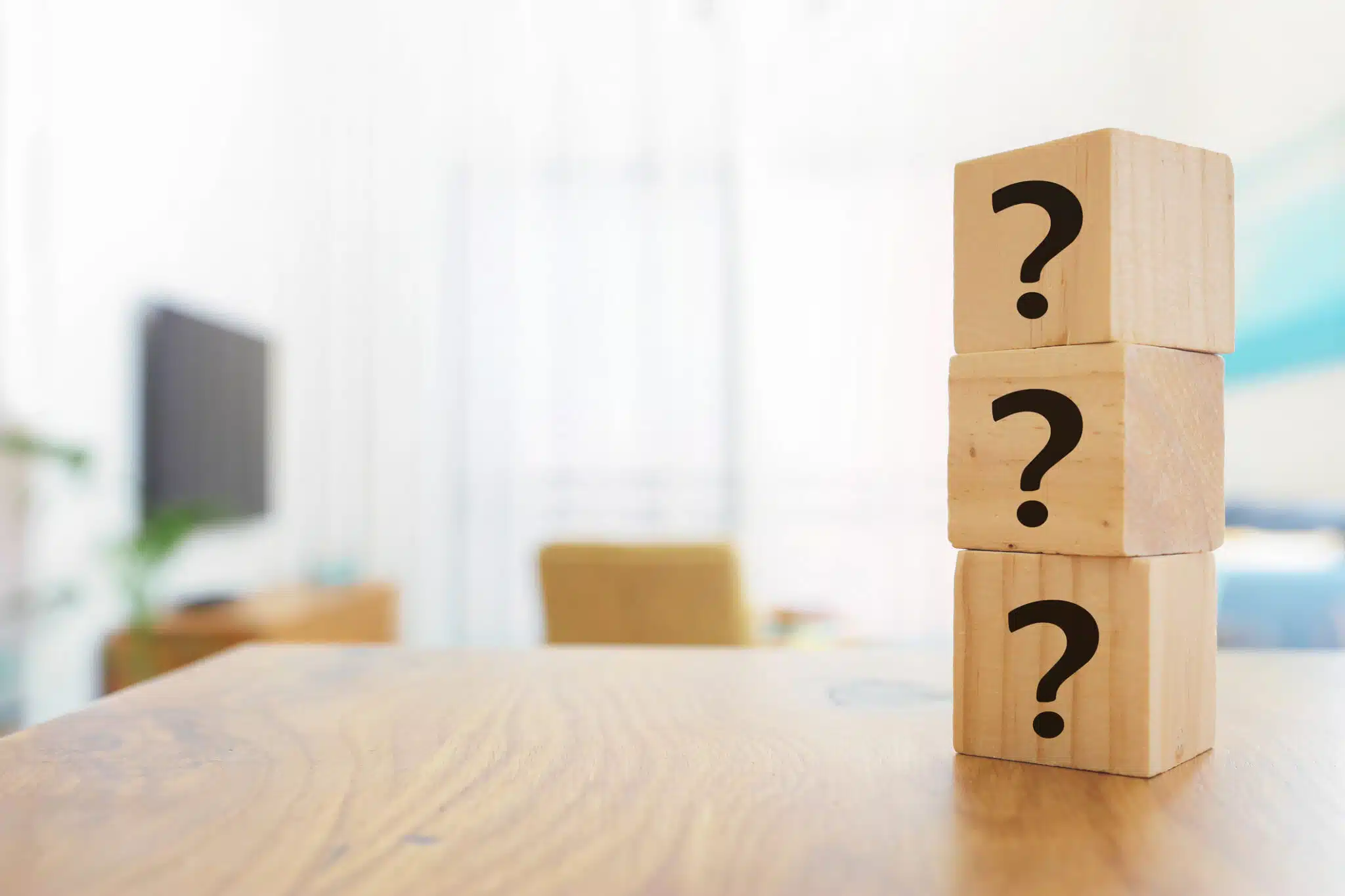 Questions Mark with wooden cube blocks on interior table background, HVAC on Indoor Air Quality.