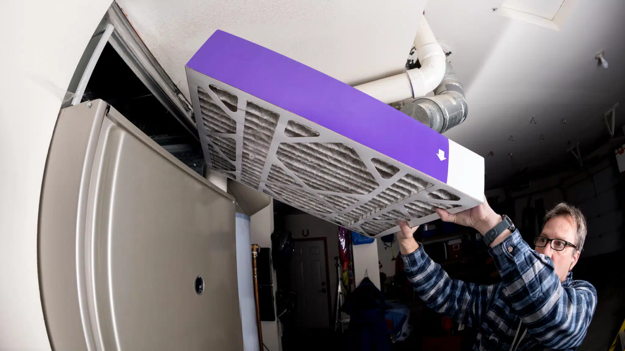 Changing air filter, HVAC Installations.
